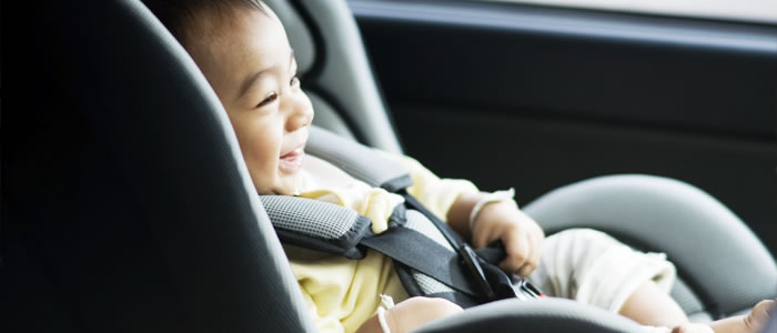 Baby sitting in a car seat